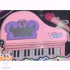 Picture of Pink piano with tail and microphone